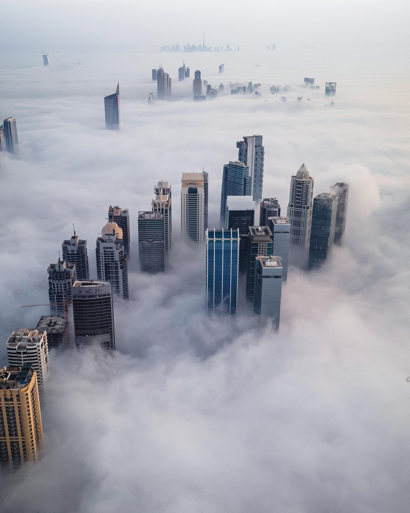 Dubai Skyscrapers Rising Above Morning Fog